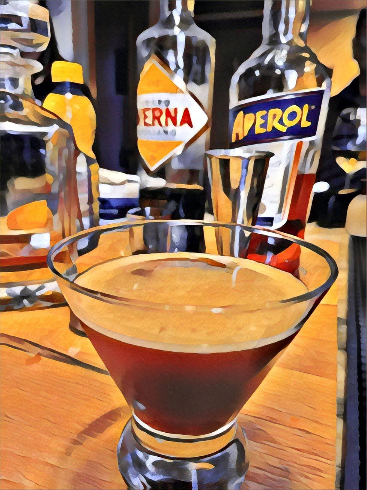 A Black Manhattan in a coupe, dark and clear, with a brandied cherry