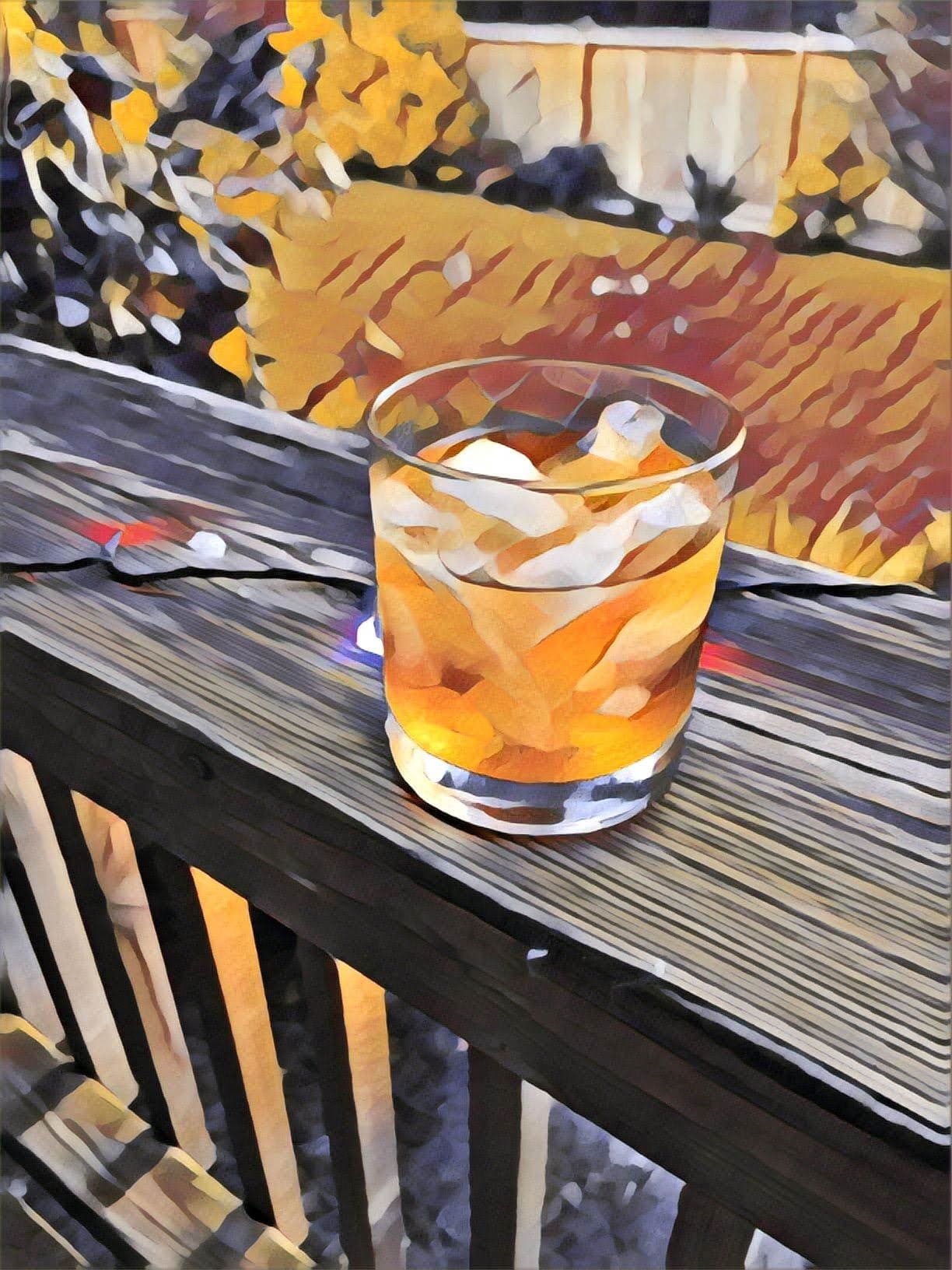 Steve's Modern Old Fashioned in a rocks glass over a large cube, with an orange peel